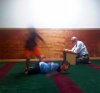 kids playing while a brother tries to read Quran.jpg