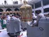 The Haram Heroes busy cleaning in the mataaf, around the Maqaami Ibraheem..jpg