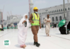 Security officers assist pilgrims .png